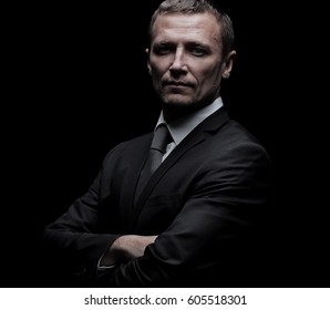 Handsome Mature Business Man Isolated On Black Background