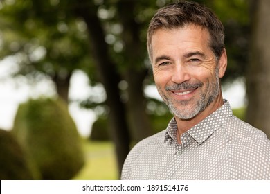 Handsome Mature Happy Man Smiling At The Camera. Outside