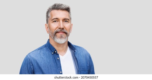 Handsome Mature Man Close-up Portrait, Isolated On Gray Background. Middle Age Man Looking At Camera. Male Beauty, Active Seniors, Modern Lifestyle, People Concept