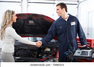 Handsome Mechanic And Client Woman In Auto Repair Shop.