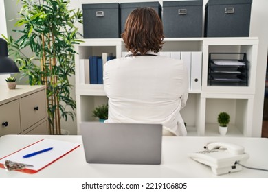 Handsome Middle Age Doctor Man Working At The Clinic Standing Backwards Looking Away With Crossed Arms 