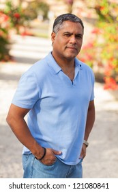 Handsome Middle Age Hispanic Man In Casual Clothing Outdoors.