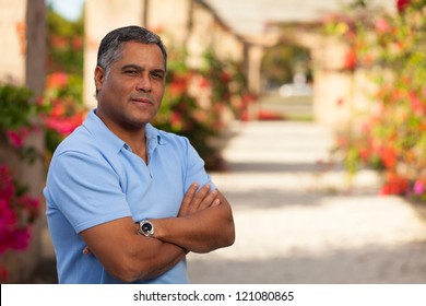 Handsome Middle Age Hispanic Man In Casual Clothing Outdoors.