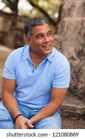 Handsome Middle Age Hispanic Man In Casual Clothing Outdoors.