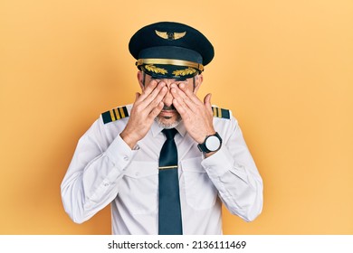 Handsome Middle Age Man With Grey Hair Wearing Airplane Pilot Uniform Rubbing Eyes For Fatigue And Headache, Sleepy And Tired Expression. Vision Problem 