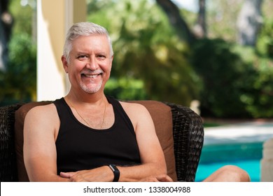 Handsome Middle Age Man Outdoor Portrait In A Home Patio Setting.