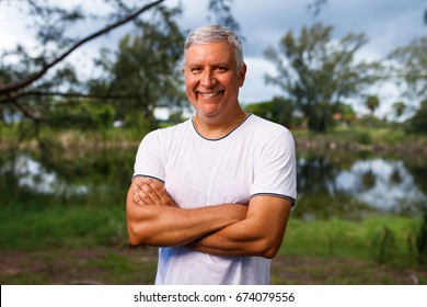 Handsome middle age man outdoor portrait. - Shutterstock ID 674079556