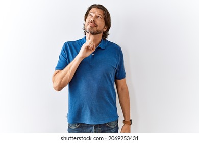 Handsome Middle Age Man Standing Together Over Isolated Background Thinking Concentrated About Doubt With Finger On Chin And Looking Up Wondering 