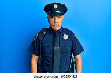 Handsome Middle Age Mature Man Wearing Police Uniform Depressed And Worry For Distress, Crying Angry And Afraid. Sad Expression. 