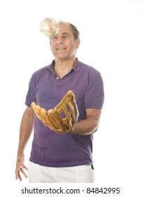 Handsome Middle Age Senior Man Softball Catching Ball In Baseball Glove On White Background