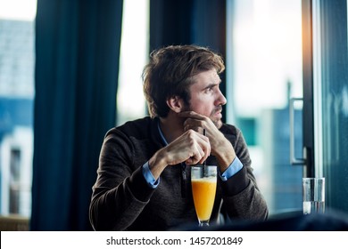 Handsome Middle Aged Man Waiting Alone In Restaurant 