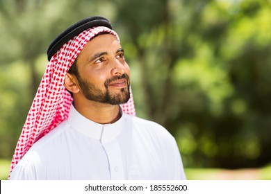 Handsome Middle Eastern Man Looking Up Outdoors