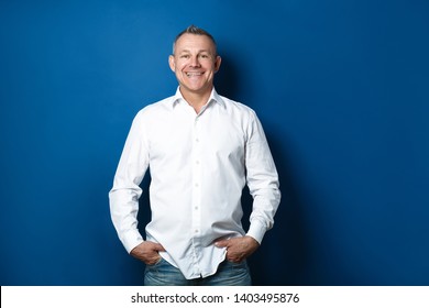 Handsome Middle-aged Man On Color Background