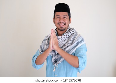 Handsome Moslem Asian Man Smiling While Doing Hand Praying Gesture