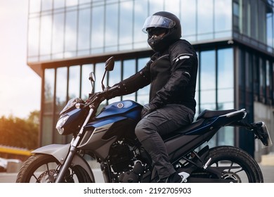 Handsome Motorcyclist On His Moto Riding In The City