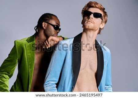 Handsome multicultural men in elegant dapper style standing side by side.