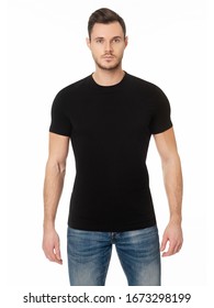 A Handsome Muscular Guy In A Black T Shirt. Mockup Of A Template Of A Black Man's T-shirt On A White Background. 