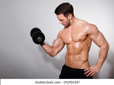 Handsome Muscular Man With Dumbbell