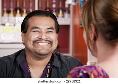 Handsome Native American Man With Female Friend In A Restaurant