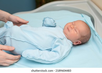 Handsome Newborn Baby Boy Lying In The Crib In The Hospital.