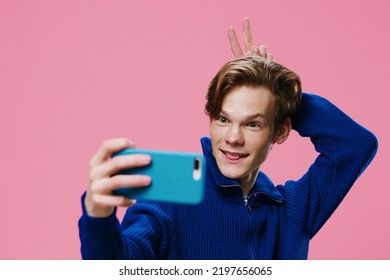 Handsome Nice Redhead Guy Makes A Funny Selfie With His Fingers Behind His Head