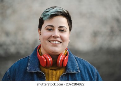 Handsome non-binary woman smiling outdoors - Shutterstock ID 2096284822