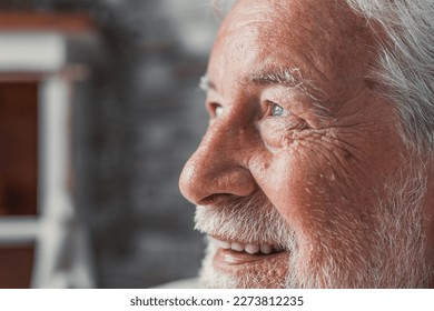 Handsome older man smiling staring at camera feels happy, close up face view. Senior advertise professional dental clinic, teeth repair and check up services, medical insurance cover for elder concept - Powered by Shutterstock