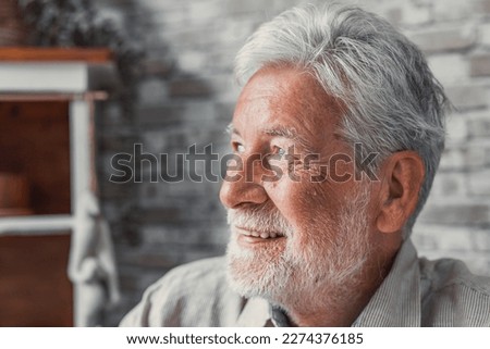 Handsome older man smiling staring at camera feels happy, close up face view. Senior advertise professional dental clinic, teeth repair and check up services, medical insurance cover for elder concept