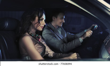 Handsome Pair Driving At Night