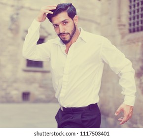 Handsome Passionate Man Dancing Alone Outdoors Against Old Stone Castle