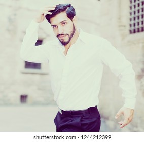 Handsome Passionate Man Dancing Alone Outdoors Against Old Stone Castle