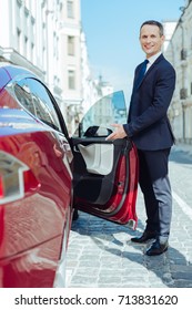 Handsome Polite Man Opening The Car Door