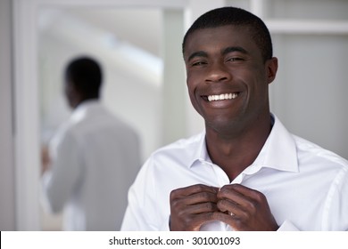 Handsome Professional African Black Man Getting Ready Morning Routine Shirt At Home For Work