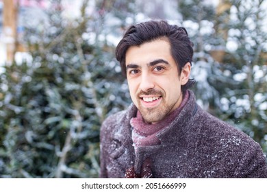 Handsome Russian Man Shopping For Christmas Tree Outdoors Market