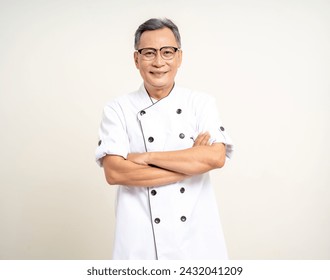 Handsome senior chef asian mature old man standing arm crossed on isolated white background. Happy Portrait of cheerful smiling senior asian man. Mature People and lifestyle - Powered by Shutterstock