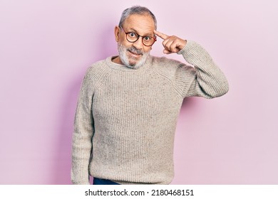 Handsome Senior Man With Beard Wearing Casual Sweater And Glasses Smiling Pointing To Head With One Finger, Great Idea Or Thought, Good Memory 