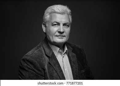 Handsome Senior Man In Blazer On Dark Background, Black And White Effect