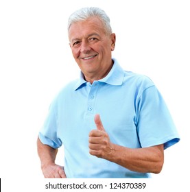Handsome senior man in bright polo-shirt shows thumb up.