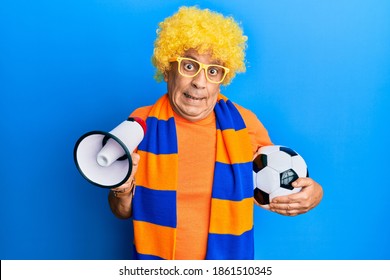 Handsome Senior Man With Grey Hair Football Hooligan Cheering Game Looking At The Camera Blowing A Kiss Being Lovely And Sexy. Love Expression. 