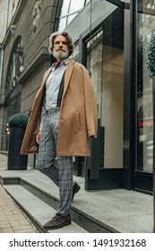 Handsome Senior Man Leaving The Store Stock Photo