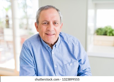 Handsome senior man smiling confident - Shutterstock ID 1323899555
