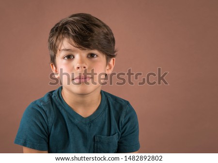 Image, Stock Photo Brown-haired boy with an athletic physique on an athletic oval massages his muscles with a foam roller for better recovery. Post-workout