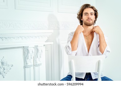 Handsome Sexy Man Wearing White Shirt Looking At Camera. Men's Beauty, Fashion Model. Hair Styling.