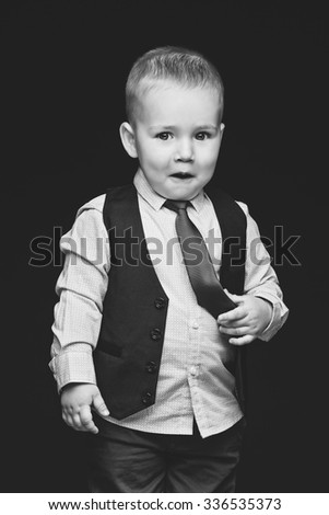 Similar – stylish little gentleman in hat looking up