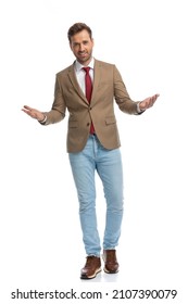 Handsome Smart Casual Man Welcoming Us With Open Arms And A Smile On His Face Against White Background