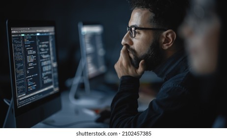 Handsome Smart Male Student, Studying in University with Diverse Multiethnic Classmates. He Works on Desktop Computer in College. Applying His Knowledge in Writing Code, Developing Software. - Shutterstock ID 2102457385