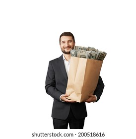 Handsome Smiley Man Holding Paper Bag With Money. Isolated On White Background