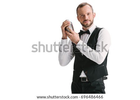 handsome smiling bartender with classical metal shaker isolated on white