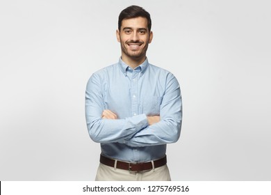 Handsome Smiling Business Man In Blue Shirt Isolated On Gray Background