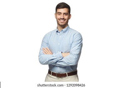 Handsome smiling business man in blue shirt standing with crossed arms, isolated on white background